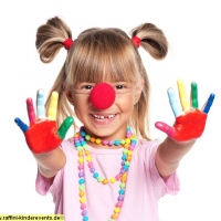 Little girl with clown nose